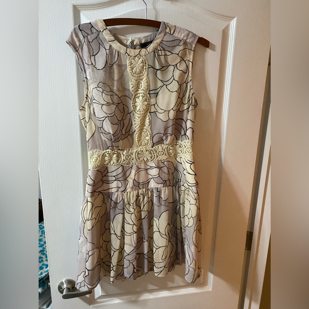 Size 6 beautiful mini dress. Never worn.